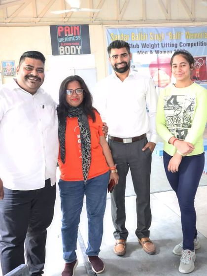 A great moment with fellow officials and athletes at a weightlifting competition. The community and shared passion for strength are what make these events special.