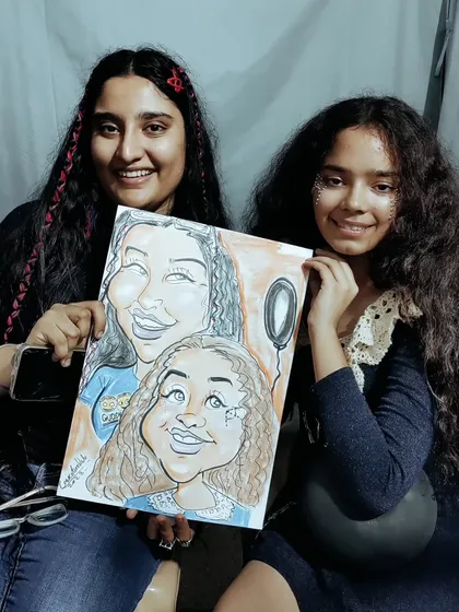 Bringing friends together with art. This colorful group caricature was a big hit, capturing the fun personalities of these two guests. I can add color on the spot to make the portraits pop even more.