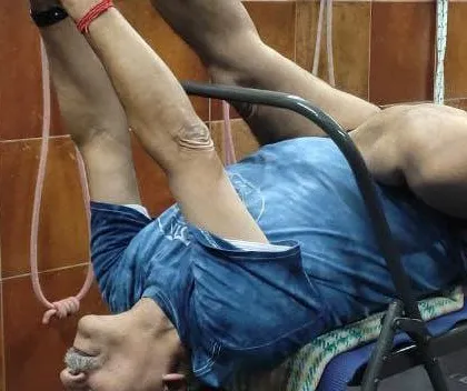 A variation of a supported backbend on a chair.
