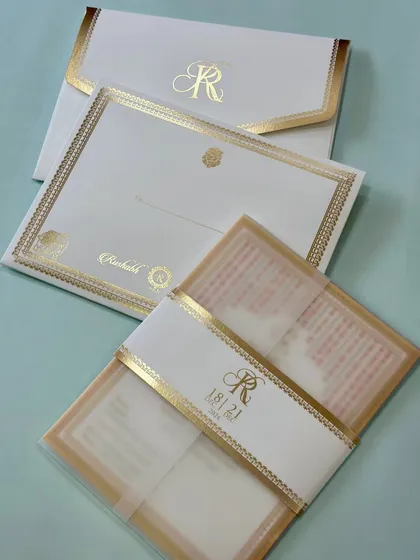Another view of our classic cream and gold vellum invitation. The clean design and luxurious materials make it a timeless choice for any sophisticated wedding.