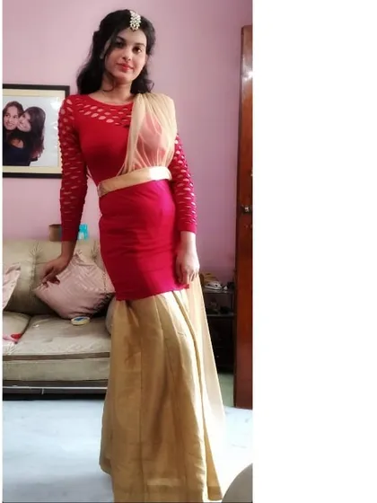 Here’s a creative way to style a western dress for an Indian occasion. I layered a red midi dress over a golden skirt and added a dupatta draped like a saree pallu to create a unique Bhai Dooj outfit.