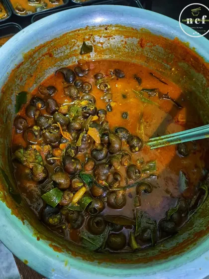 A bowl of our NCF snails curry. This is a traditional dish with a unique flavor that you won't find everywhere.