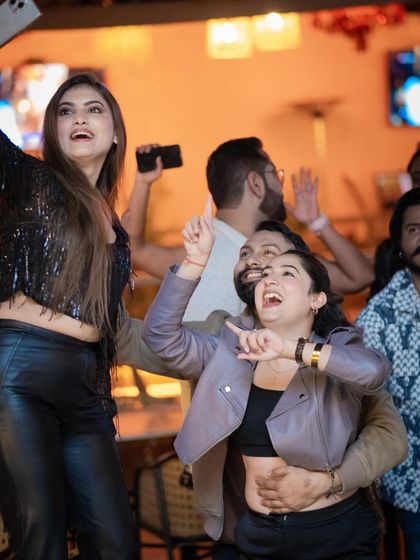 Friends taking a selfie while dancing. My gigs are all about creating shareable, fun moments.