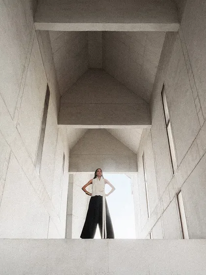 For this Payal Khandwala campaign, we shot at a stunning brutalist architectural site. The model's pose and the clean lines of her outfit complement the grand scale of the building.
