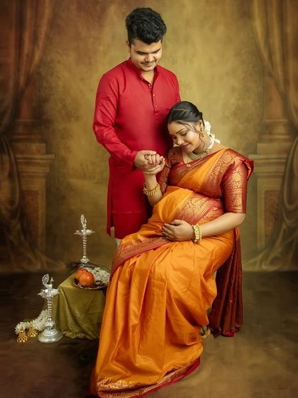 A sweet moment of connection. Holding hands while you are seated creates a lovely, intimate portrait that showcases your bond as a couple.