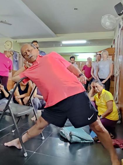 A side-angle pose variation using a chair.