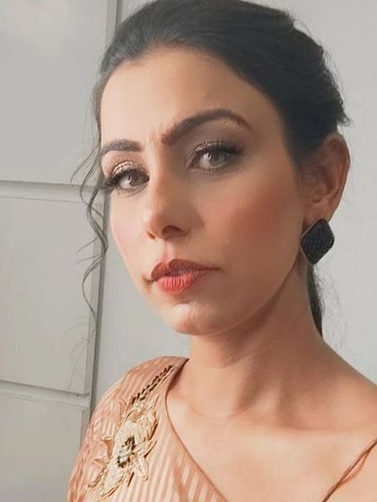 A subtle and elegant makeup look for a sister attending a mehndi function. The focus was on clean skin and soft, defined features that looked beautiful both in person and in photographs.