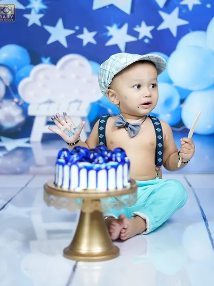 And the smashing begins! Capturing the messy, joyful, and hilarious moments of a cake smash is always so much fun.