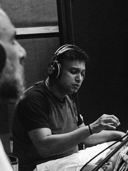 A black and white shot from our rehearsal, showing the intense focus of the musicians. We pour all our energy into preparing the music for live performance.