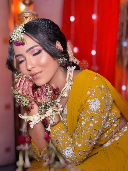 A serene and beautiful shot of the Haldi bride. The makeup is soft and glowing.