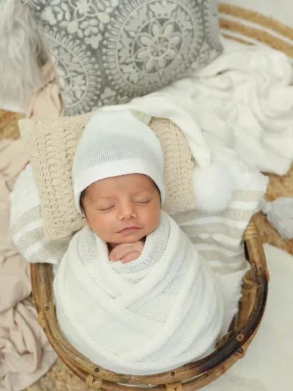 This little doll is all bundled up in white. The soft textures and neutral colors create such a pure and angelic look.