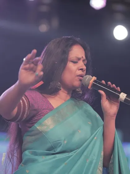 Singing my heart out at the Shivaratri concert. I am thankful to the photographers who capture these fleeting moments of passion and connection on stage.