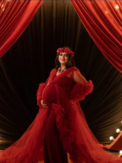 Step into the spotlight with our dramatic stage-lit setup. Featuring bold red curtains and marquee lights, this backdrop is designed for moms-to-be who want a glamorous, show-stopping maternity portrait that feels like a grand announcement.
