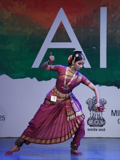 A powerful, dynamic pose from our 1st place winner in the senior category. Her strength and precision are evident in this shot.