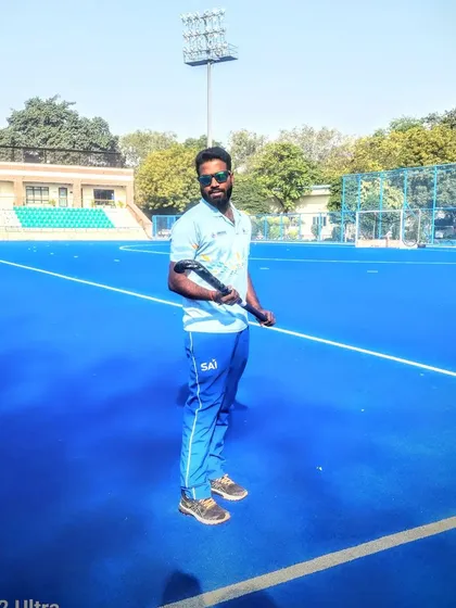A moment of calm on the field. The blue turf is my office, my canvas, and my sanctuary.