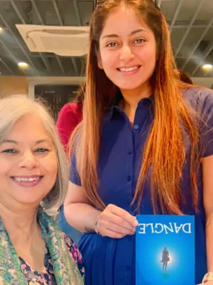 A member with her copy of "Dangle," a thriller by Sutapa Basu. It was an honor to hear the author speak and learn about the unknown historical facts that inspire her work.