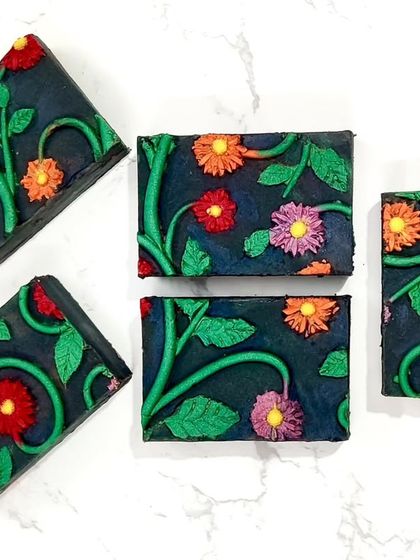My entry for a silicone mat impression challenge, titled "In Darkness We Bloom." I sculpted the floral design myself, made a silicone mat from it, and poured the soap.