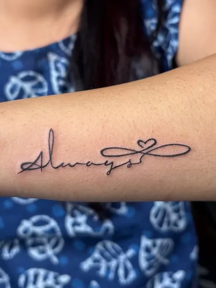 The word "Always" combined with an infinity symbol and a heart. A simple, elegant, and timeless message of love, done in a flowing script.