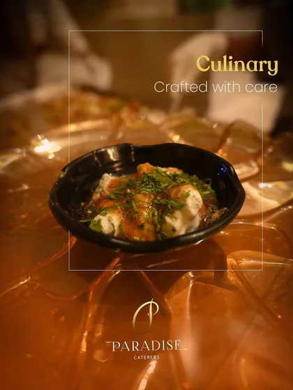 Crafted with care, served with soul. A bowl of authentic Indian chaat, garnished with fresh herbs, showcasing our commitment to traditional flavors.