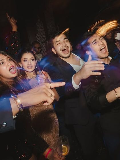 Some nights are meant to be danced through. This photo captures the wild, uninhibited energy of the dance floor during the after-party.