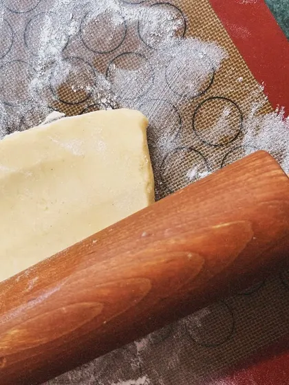 Rolling out the pastry dough on a silicone mat. I believe in old-school techniques and doing things by hand.