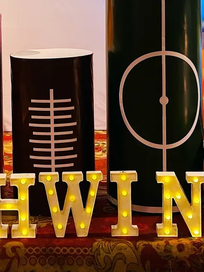 Sports-themed pedestals and marquee letters spelling out the birthday boy's name, 'Ashwin'.
