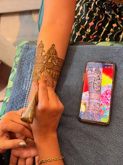 Precision comes from practice. Here, I am demonstrating how to replicate a complex design from a phone reference, a key skill for any professional artist.