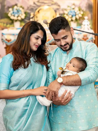 A serene portrait of new parents with their newborn. These sessions are handled with great care to capture the delicate features and peaceful moments of your baby's first days.