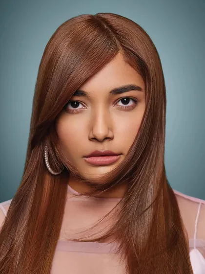 A close-up beauty headshot for Schwarzkopf Professional's "Elysian Fields" look. I created a soft, luminous makeup look with a neutral palette to complement the sleek, copper-toned hair.