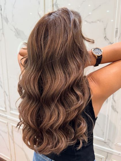 Another view of the walnut hair color balayage, showing the beautiful blend of colors and healthy shine.