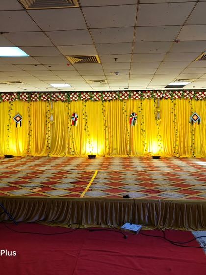 A duplicate image of the classic Haldi stage with a yellow backdrop, ready for the ceremony.