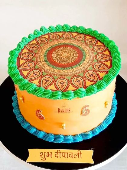 A very Happy Diwali from me to you! This festive cake features a beautiful, traditional mandala design printed on an edible sheet, with colorful buttercream piping.