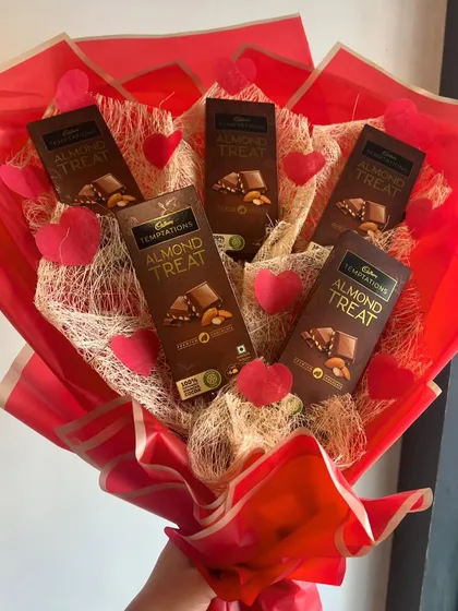 A hand-held view of our chocolate bouquet. It's a fun and delicious alternative to traditional flowers, perfect for any occasion.