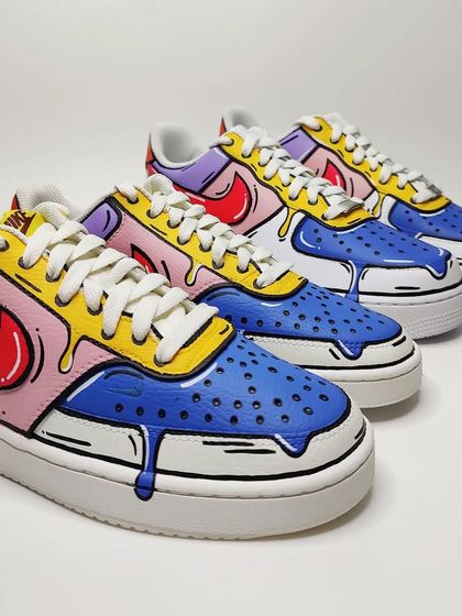 A lineup of coordinated Nike Air Force 1s with a cartoon drip design. This shows how I can create a fun, unified theme for a team or group, while allowing for slight variations.