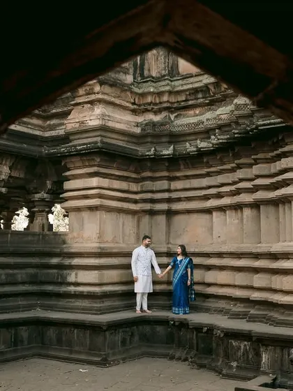Set against the grand architecture of the Sangam Mahuli temple, this frame tells a story of love as timeless as the stone itself. I love using such epic backdrops to give your pre-wedding portraits a sense of history and grandeur.