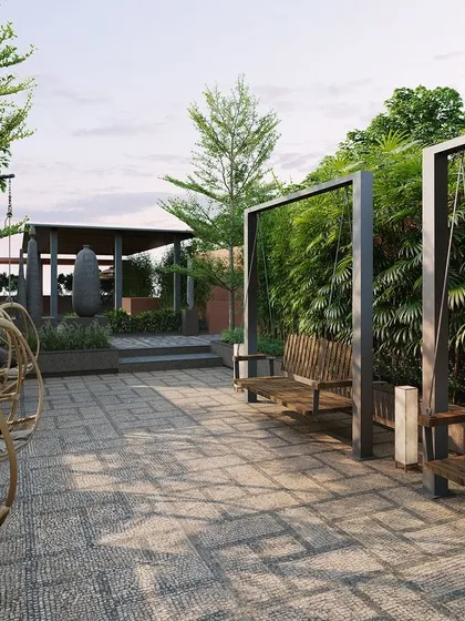 Quiet corners for relaxation are essential in our designs. This seating area with modern swings and benches, framed by vertical green walls, offers a peaceful retreat for residents to unwind.