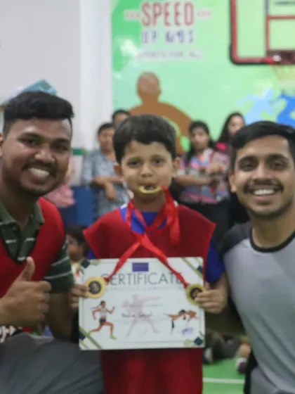 This champion is biting his medal. A classic victory pose. We love the enthusiasm.