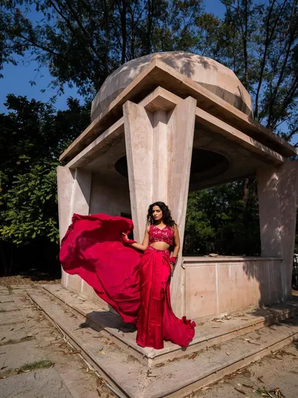New pieces in now. This red dhoti saree is a bold and modern choice for any festive occasion.