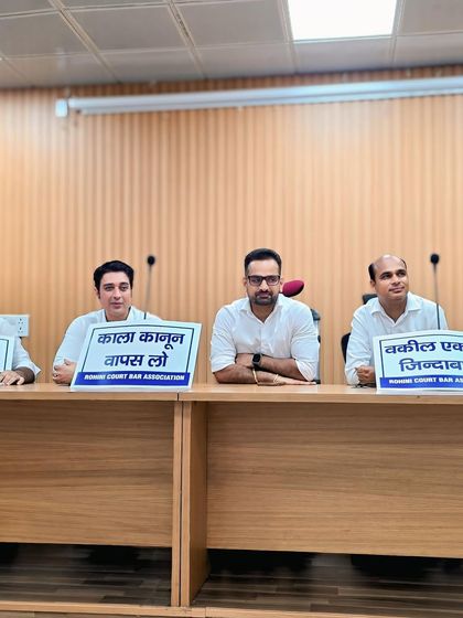 Seated with other advocates during a press conference to oppose the notification. Presenting a united front is essential when we are fighting to uphold legal principles and protect the rights of citizens.