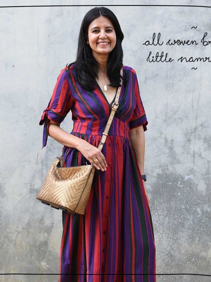 The All Woven Bronze Little Namrata is a perfect size for day-to-night wear, as shown here by our model Tulika.