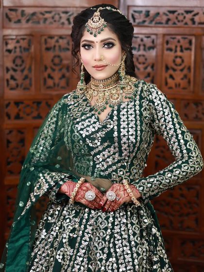 This bride looks stunning in her green lehenga with silver work. I created a dramatic eye look to match the modern, edgy vibe of her outfit.
