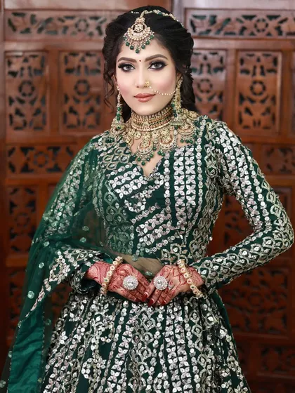 This bride looks stunning in her green lehenga with silver work. I created a dramatic eye look to match the modern, edgy vibe of her outfit.