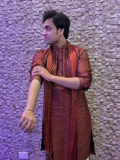 A close-up shot showing the details of the brocade on my maroon kurta. This highlights the quality of the garment, an important aspect for fashion modeling.