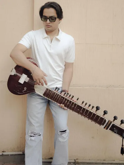 A stylish portrait in a white polo and jeans. This shows the modern, casual side of my personality.