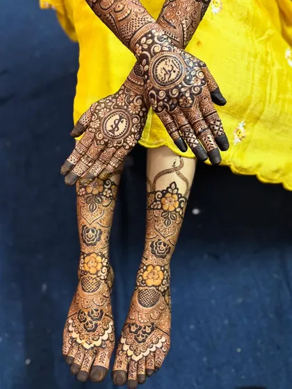 Here you can see the back of the hands and the feet design together. The central mandala on the back of the hand is complemented by the floral work on the feet.