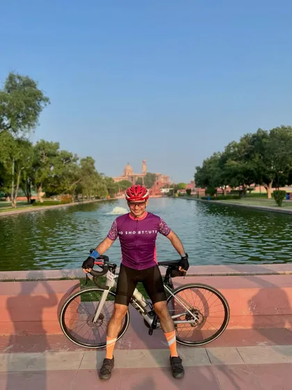 Enjoying the view with his bike at a scenic spot.