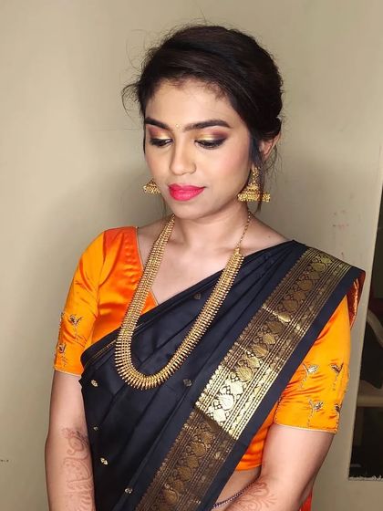 A beautiful shot of Deepa's party makeup. The focus is on the dramatic eyes, balanced with a simple hairstyle.