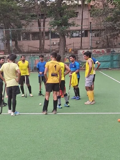 A team huddle during a practice game. Communication and strategy are key elements we focus on in our training.