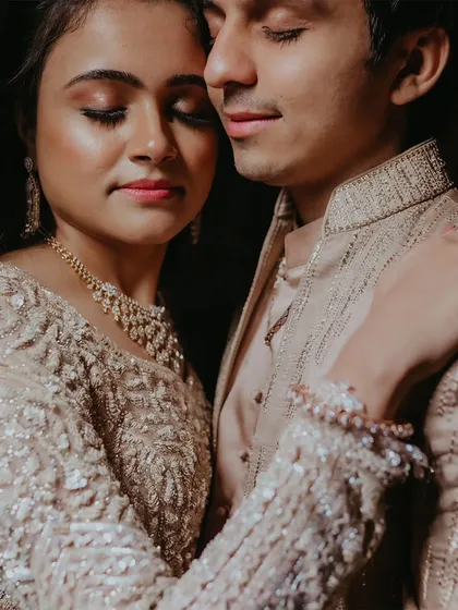 A close-up, intimate portrait of a couple, capturing a tender moment during their engagement shoot.