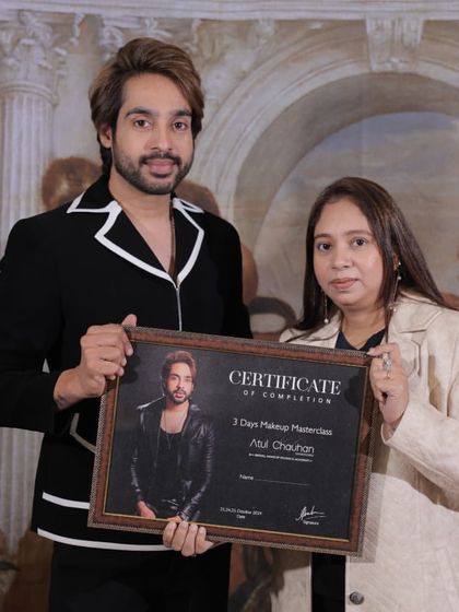 A smiling graduate, certificate in hand. She is now equipped with the techniques to excel as a makeup artist.